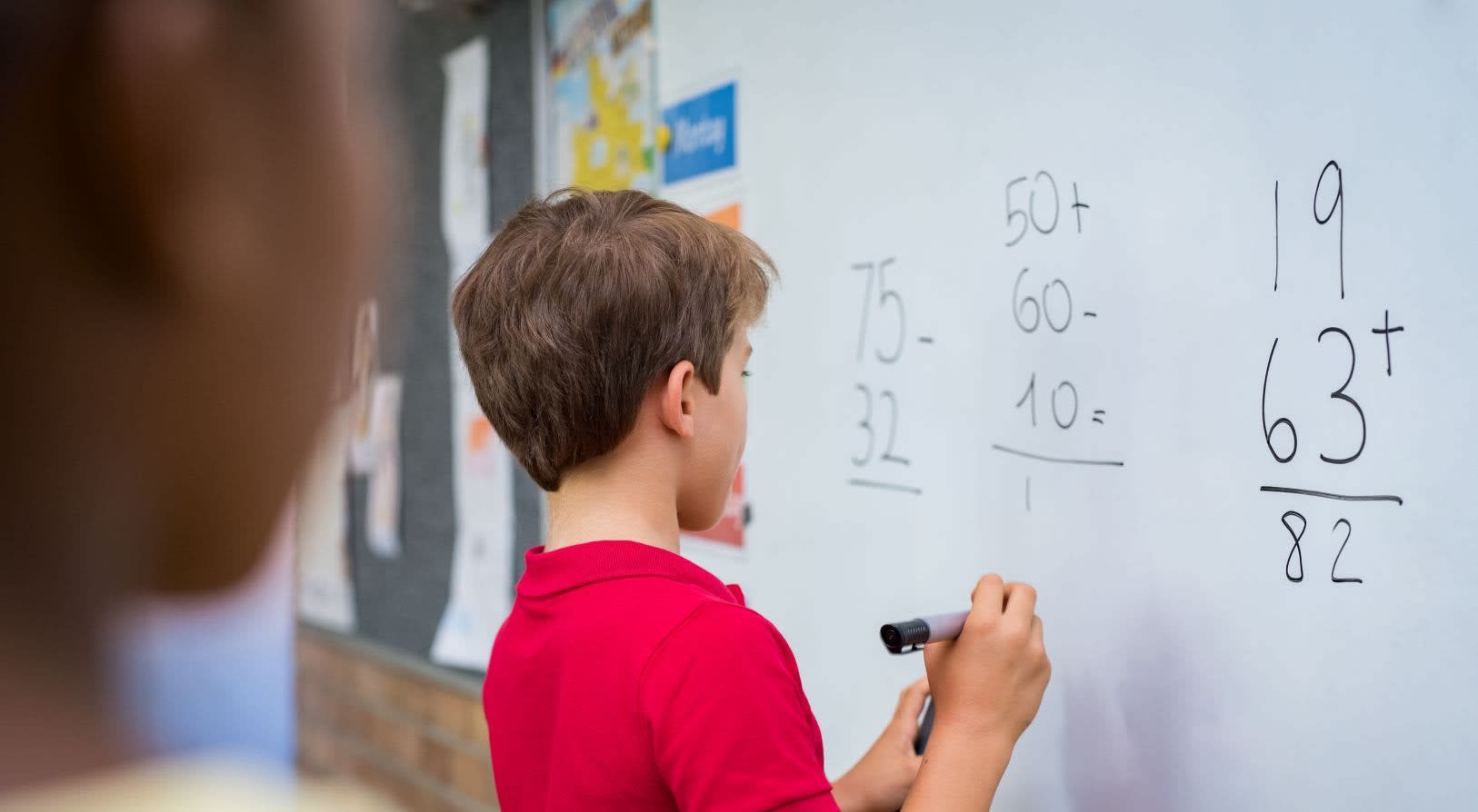 Child writing on a whiteboard